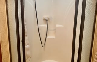 A 5th wheel travel trailer suited for 2 people