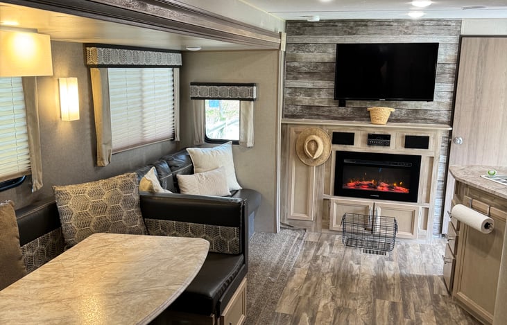 Can't beat a fireplace, speaker system and two TVs to stay entertained on those rainy days