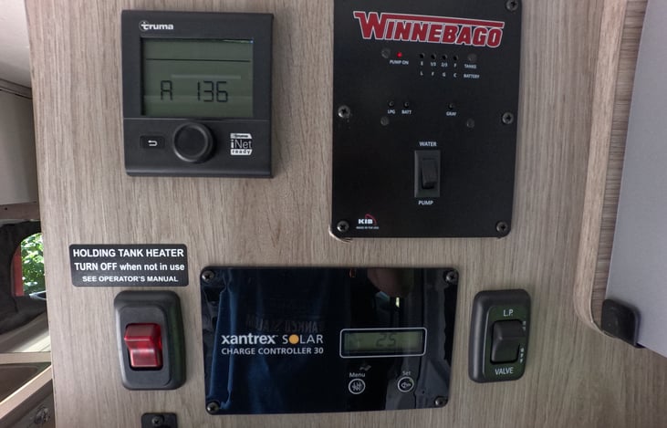 Thermostat, Propane, Gray Water and Electric gauges, propane and water heater switches all in one place.