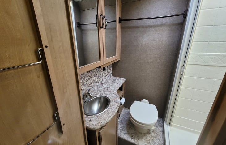 hall door entrance to comfortable bathroom with shower