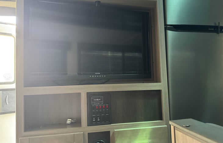 42" TV with Bluetooth, and DVD player, if you still use those.  There is a Roku attached as well, so just link your Wi-Fi and watch away.  Link to the Bluetooth and play music inside and outside.