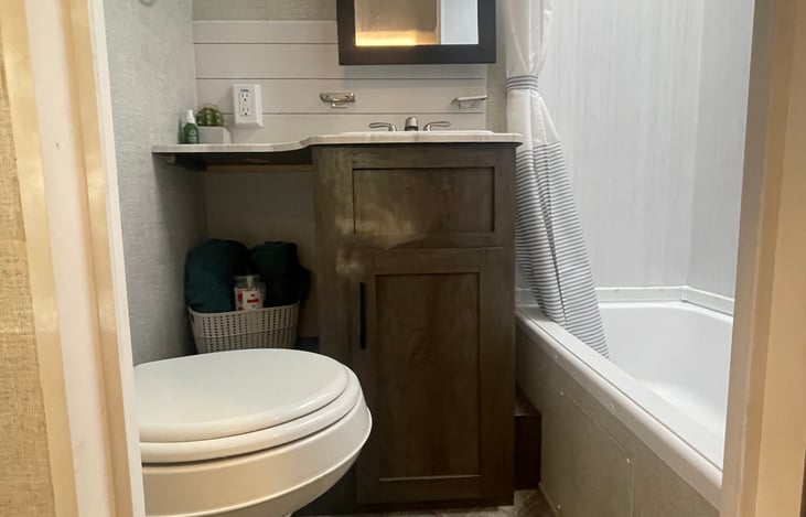 Restroom with a shower/tub combo