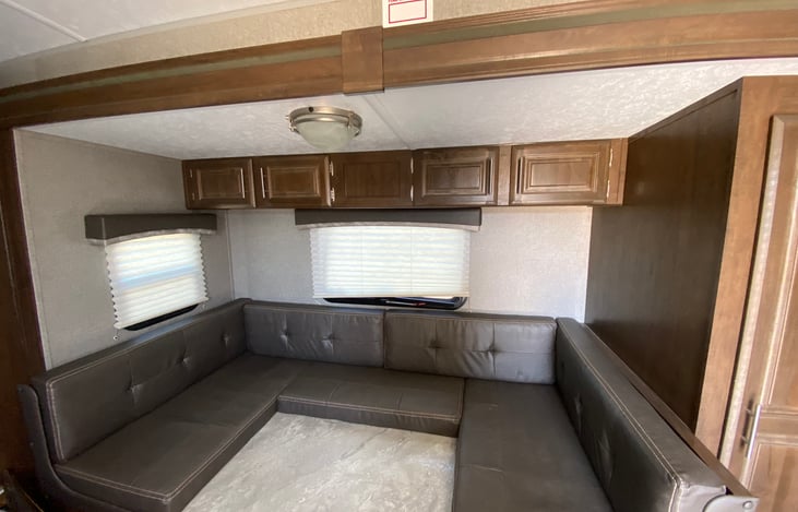 Kitchen table folds down for an extra bed if needed.