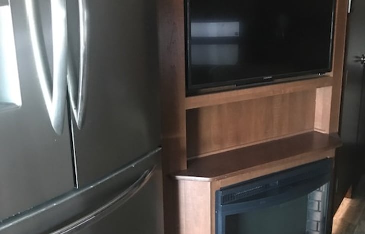Full size fridge, TV, fireplace