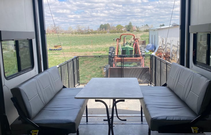Bottom bunk is the dining room table! Back ramp opens to outside for deck enjoyment