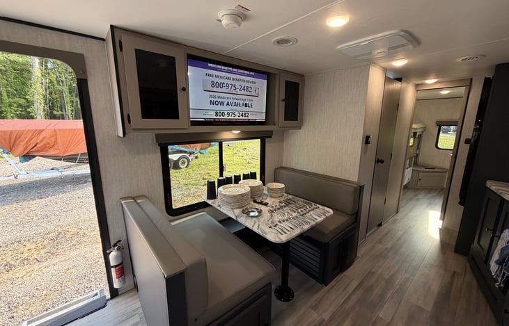 Spacious Dinette and TV. Dishes, cups and silverware included in all rentals.
