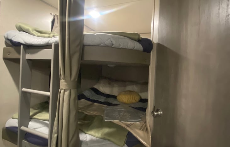 Bunk house ... longer than a king bed , and wide as a FULL size ... easily fit teens or 2 babes per bunk!