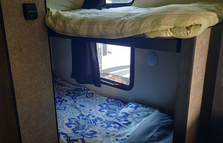 Bunk beds, each with individual lights and windows. NEW linens coming soon for 2023!