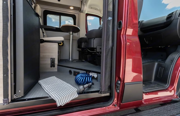 Galley with indoor/outdoor functionality
With its forward-facing refrigerator, pullout counter extension, the galley is designed to allow easy access from  inside or outside the coach.