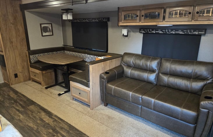 Main living space. Sofa and dinette both turn into beds.
