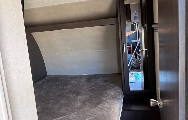 Bedroom with walk around queen bed, tv, 2 closets