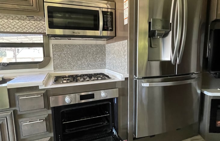 Full size refrigerator/freezer with ice & water dispenser.