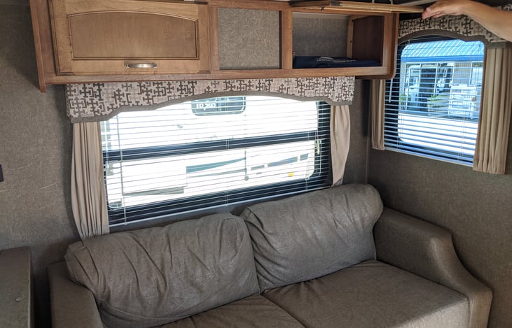 COUCH FOLDS DOWN TO A BED & STORAGE UP TOP