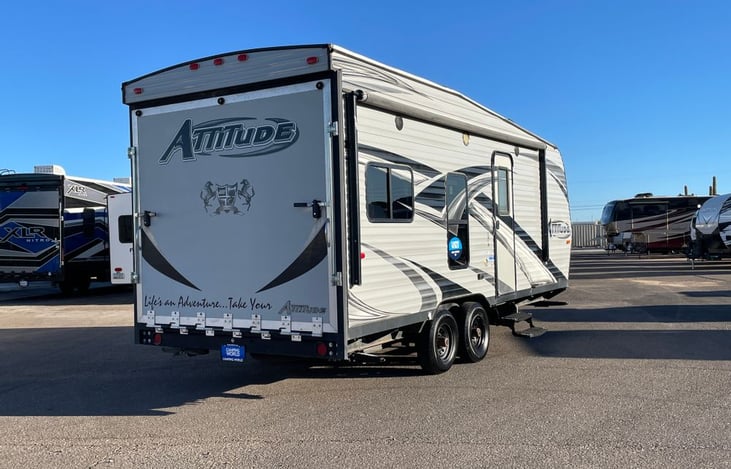 With a dry weight of 5600 it is easily towable with a 1/4 ton truck with a brake controller.