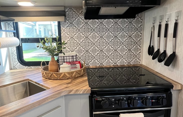 Clean, modern design with functional prep and cooking space.