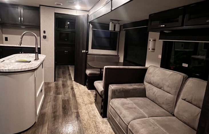 Table and couch fold out to beds.