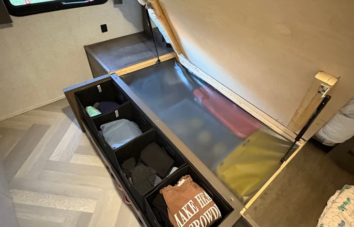 Master bedroom under bed clothes storage containers