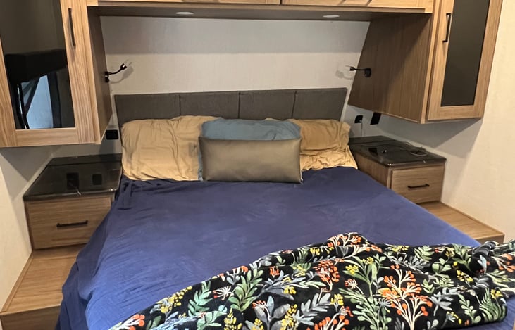 queen bed room with ample storage