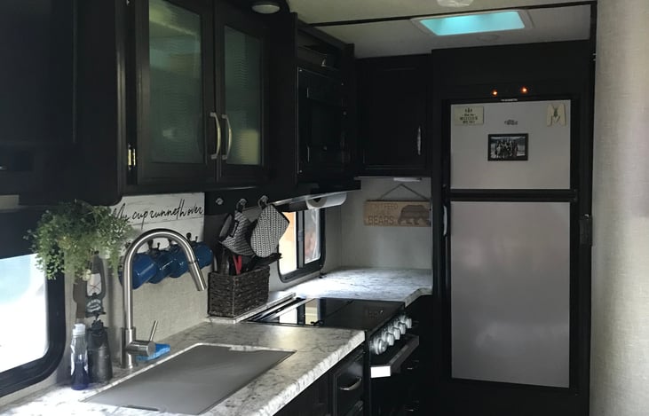 Large freezer and fridge - microwave and cooktop/oven.