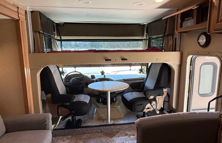 Retractable Double Bed. Additional seating for hanging out, games, or eating.