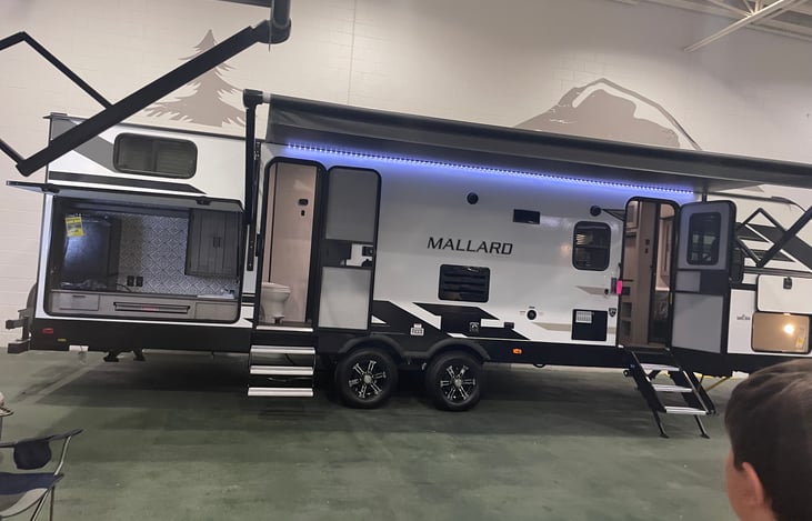 Outside Picture of camper, we love that kiddos can access the bathroom from outside, and the outdoor kitchen!