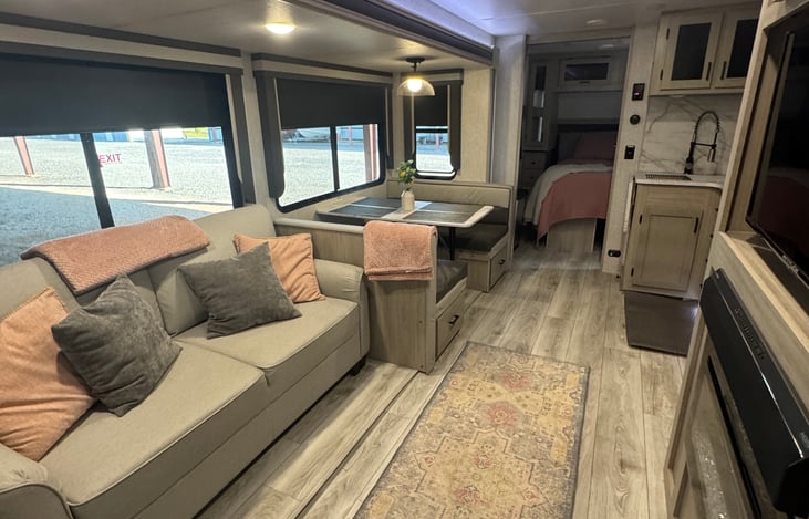 Open view- couch (pulls out a bed) and  dinette for 4