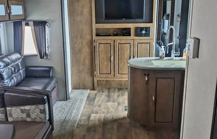 View from Bunkhouse and bathroom entry looking at the living space and master bedroom entrance.