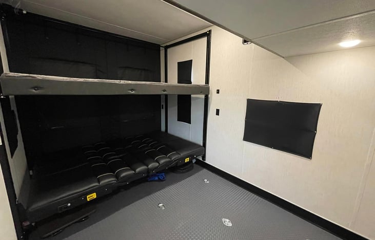 Two Q beds. The bottom will fold out into two couches for more seating!