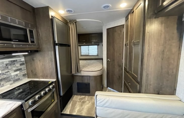 View of the living area of the RV from the front.