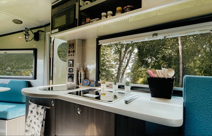 Kitchen with everything closed up except for storage above countertop.
