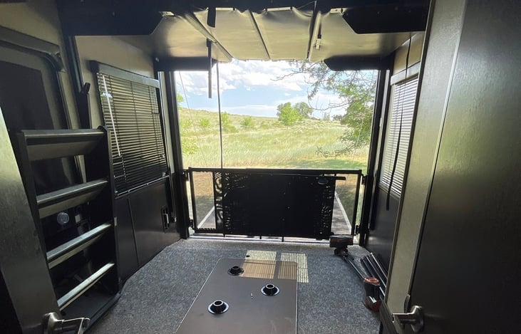 Garage view. Two queen beds drop down from the ceiling.