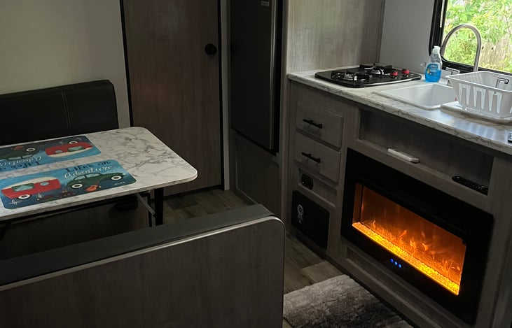 Microwave,  fridge, stove, fireplace, sink