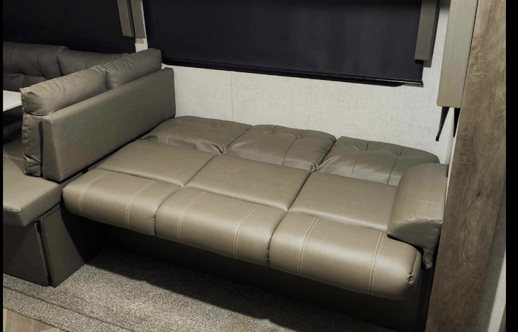 Jackknife couch converted into bed.