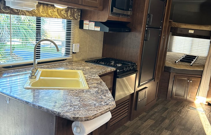 Spacious stocked kitchen. Includes Ninja Coffee maker, toaster oven, crock pot, electric mixer and a countertop ICE MAKER!  Dishes, silverware, pots & Pans, lots of utensils, assorted storage bags.