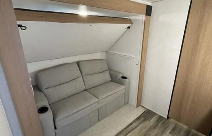 2nd bedroom sofa, door to the right is to a separate 1/2 bath.