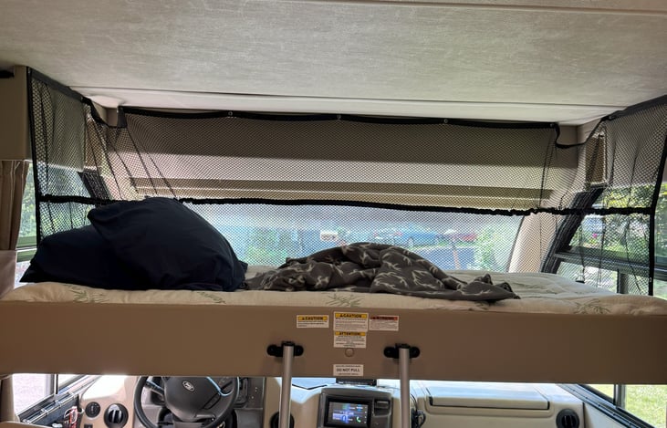 Couch before it was made up after sleep over with drop down comfy bed  .