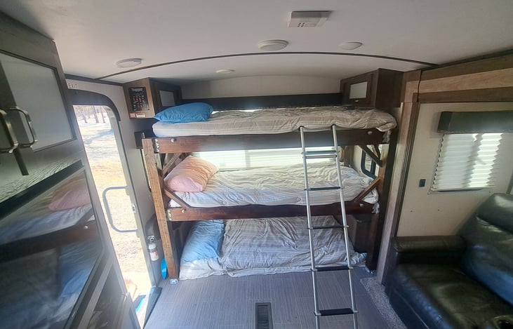 Triple bunk with backpack hooks
