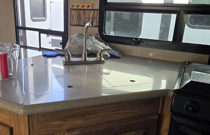 nice sized kitchen with double bowl sink and overhead cupboards. we have provided all the essentials for food prep.