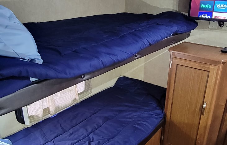 Bunkhouse with 3 twin beds and dining area that's folds down Into a bed if needed for another sleeping arrangement. 
32" smart tv if wifi available in area. If not dvd available