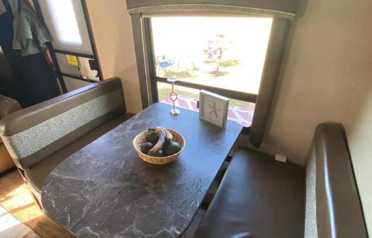 Dining room table that folds down into a bed. We utilize this space for the pack n play for our toddler to sleep in. Just fold it down and place it on top.