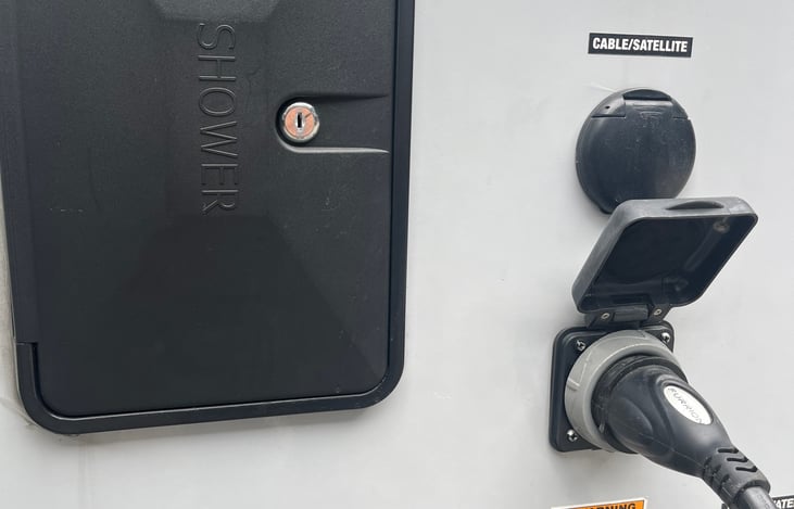 Outdoor shower, 30 amp hook up, cable/satellite connection.