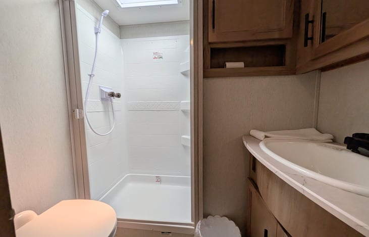 Spacious bathroom with large shower.