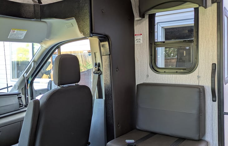 Seat behind the passenger