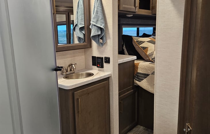 Two door walk through bathroom. Access from bedroom and access from living space.