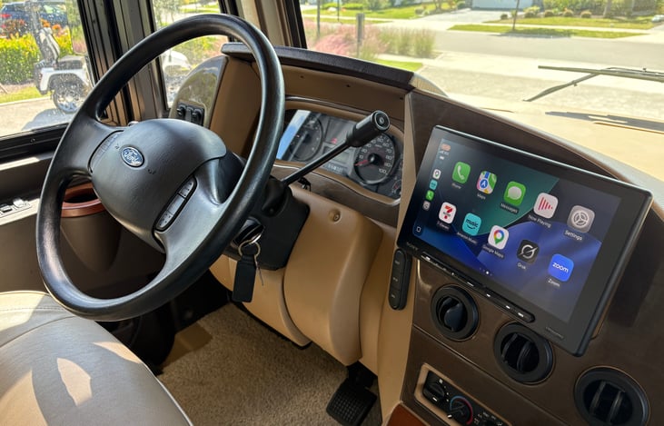 the coach has a rear and side cameras that automatically show up on the large screen when in reverse or when the turn signal is on