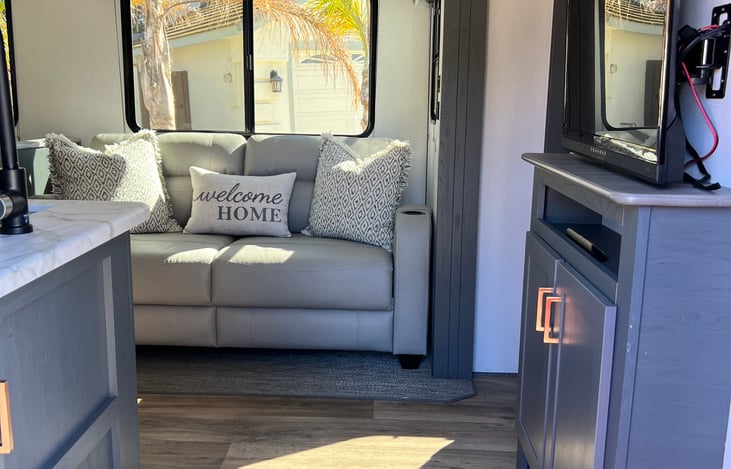 Couch and tv with Bluetooth connectivity. Couch can be converted into a bed.