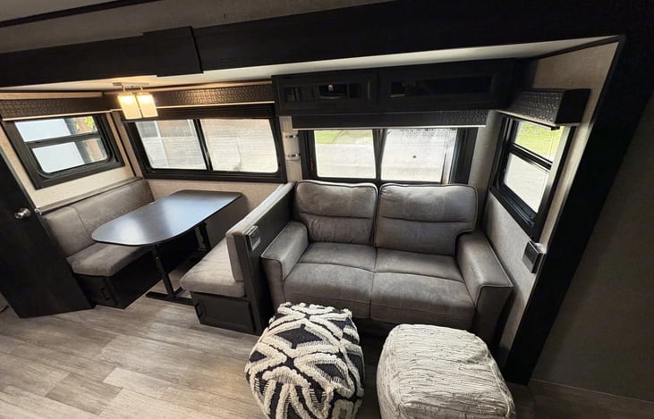 Spacious living area. Couch and table fold out into beds