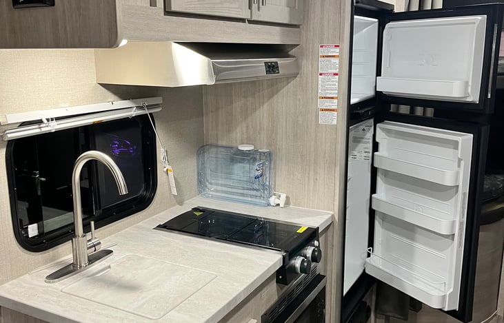 10 cu fridge, two burner stove with range hood. Microwave works if you are plugged into a power source.