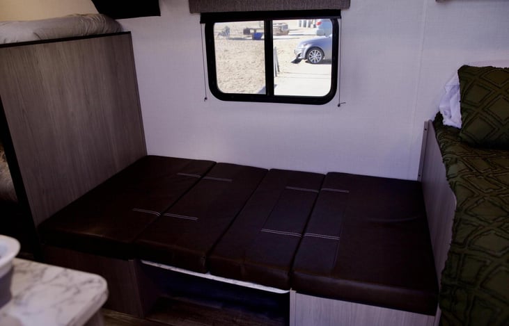 Dinette converts into an extra sleeping area.