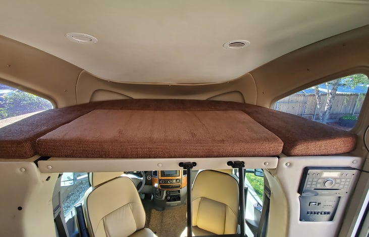 Over cab bunk can sleep 1 adult or 2 small children.